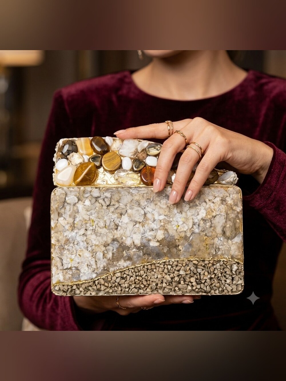 This is a rigid, box-style clutch bag with a rectangular base.